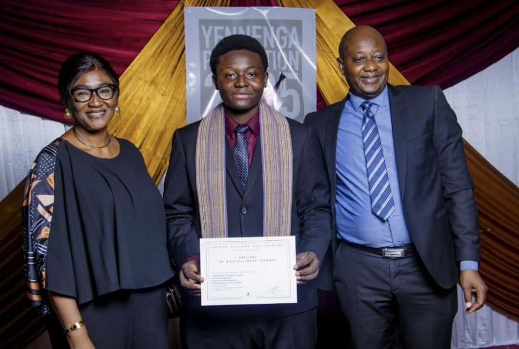 Rayann with his parents at his baccalaureate graduation ceremony.