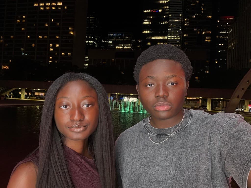 Rayann with friends in Ottawa at night.